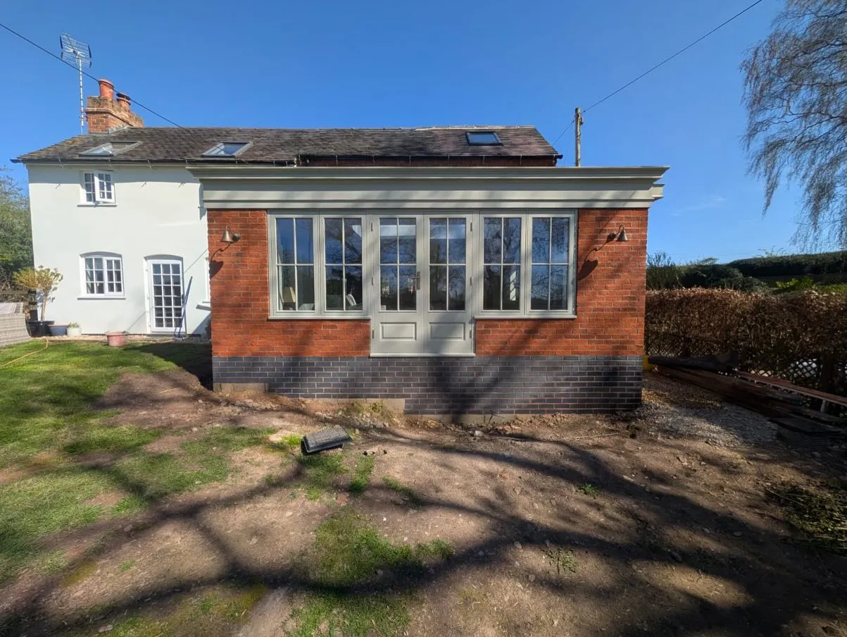 Single-storey brick extension with glazed doors