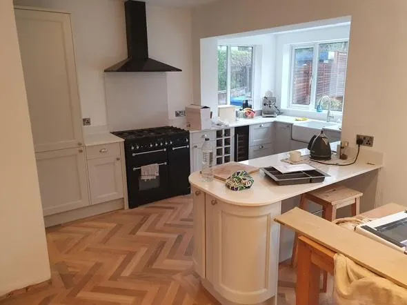 Kitchen with fitted cupboards and timber flooring